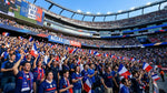 France supporters waving French flags beneath “Allez les Bleus” banners in a packed Boston stadium during the FIFA World Cup 2026.