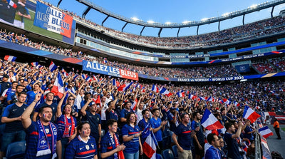 France supporters waving French flags beneath “Allez les Bleus” banners in a packed Boston stadium during the FIFA World Cup 2026.