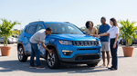 Travelers perform essential pre-departure checks on a rental car in orlando.