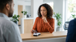 A woman presenting a credit card at a counter for a deposit hold on car hire in Texas.