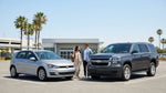 A small compact vehicle parked next to a large SUV at a sunny car hire lot in the United Estates