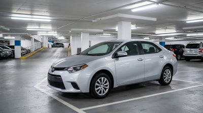 A car rental drives over the Brooklyn Bridge with the New York City skyline in the background