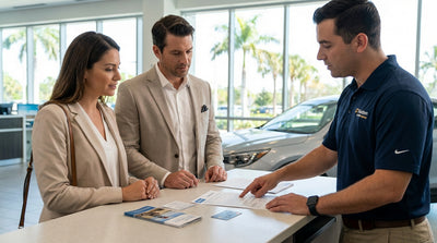 A red convertible car rental driving down a sunny, palm-lined highway on the coast of Florida
