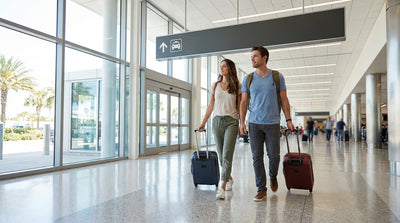 The bright, busy car hire center at Orlando International Airport with travelers at the counters