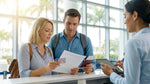 Close-up of a person handing a driving licence to an agent at a Florida car rental desk