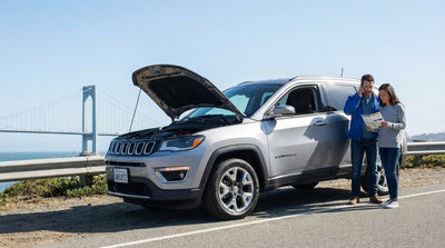 A car hire with its hazard lights on, pulled over on the Golden Gate Bridge in San Francisco