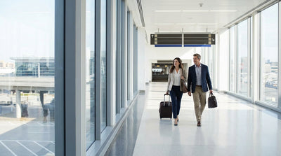 A traveler follows an overhead sign for the AirTrain to the car rental center at Newark Airport for their trip to New York