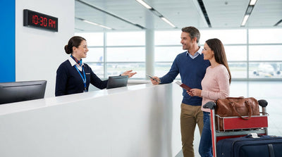 A person receiving keys for their car rental at a busy Orlando airport customer service desk