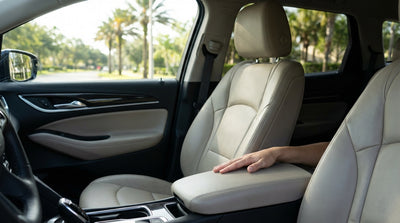 Close-up of a dark liquid stain on the passenger seat of a car rental vehicle in Orlando
