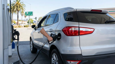 A red convertible car hire driving across the Golden Gate Bridge in San Francisco on a sunny day