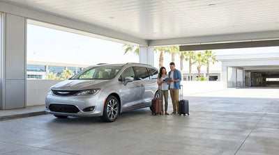 Rows of clean cars lined up in a sunny car hire lot at the Orlando International Airport