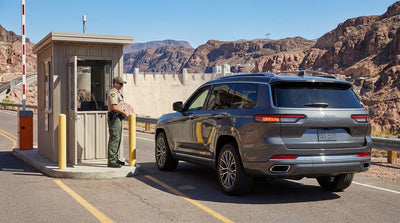 A car hire vehicle driving the scenic desert highway from Las Vegas towards the massive Hoover Dam