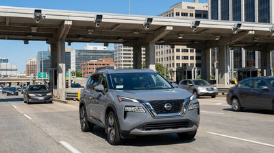 View from a car hire approaching the Lincoln Tunnel toll booths with New York City traffic in the background
