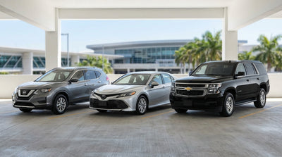 A row of various sized cars lined up in a sunny lot for car hire in the United States