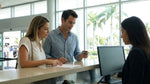 Customer handing a credit card to an agent at a car hire desk in Miami