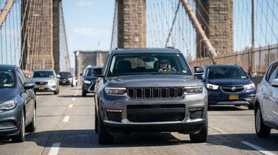 Dashboard view from a car hire crossing the Brooklyn Bridge with the New York skyline ahead