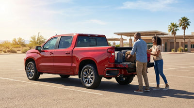 A sleek, modern car rental driving on an empty highway through the scenic landscape of West Texas