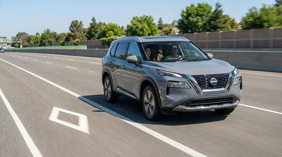 A car hire drives on the Long Island Expressway in New York next to the diamond-marked HOV lane