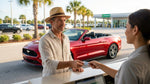 Person holding a credit card and keys in front of a white car rental vehicle in Florida