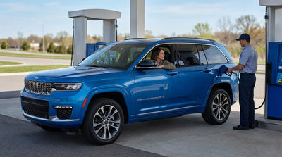 Driver's view from a car hire crossing a bridge leaving New York City, with the skyline in the rearview mirror