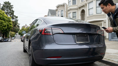 A modern car hire parked on a steep street with colorful houses in San Francisco