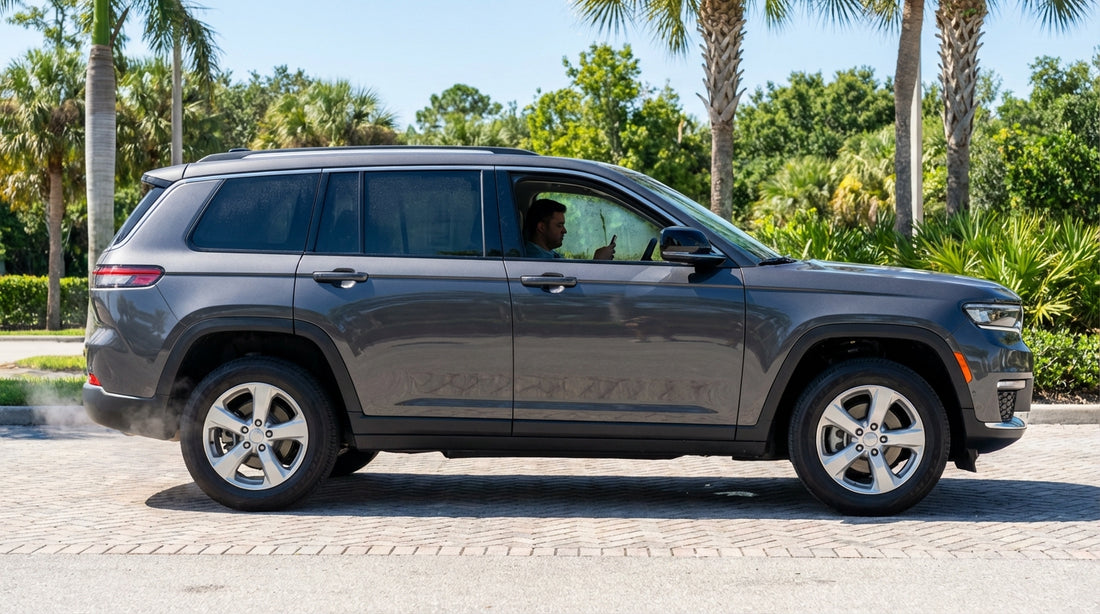 A modern car hire parked beneath a palm tree on a sunny street in Florida