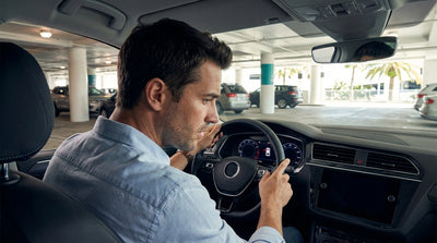 Close-up of a car rental dashboard at MCO showing a full gas tank but a low mileage range