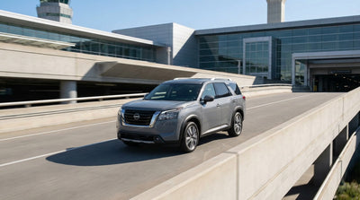 A car hire driving down a scenic highway through the rolling green hills of Pennsylvania