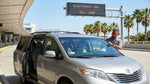 View from a car rental on the I-4 highway in Orlando showing traffic and overhead toll signs