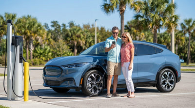A modern electric car rental charging at a station under sunny Florida palm trees