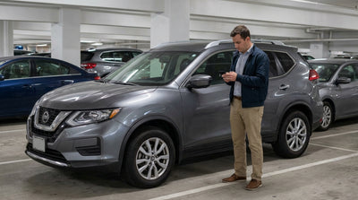 A blue car hire drives into a modern, ticketless parking garage in Philadelphia, Pennsylvania