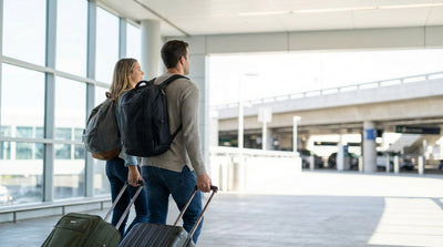 A traveler approaches the car hire desks inside the brightly lit Dallas Love Field Airport rental center in Texas