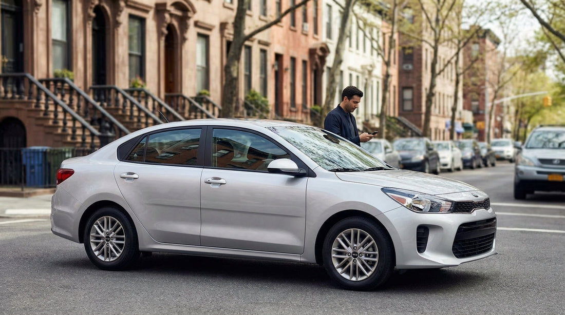 A modern car rental drives down a busy street lined with yellow taxis and skyscrapers in New York