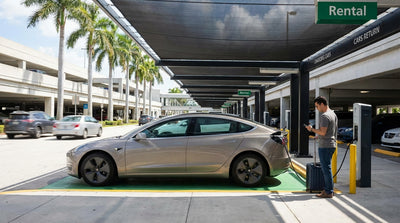 An electric car and a petrol car side-by-side in a sunny Miami International Airport car hire parking lot