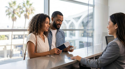 A person at a car rental counter in Los Angeles, getting the keys for their vehicle at LAX airport