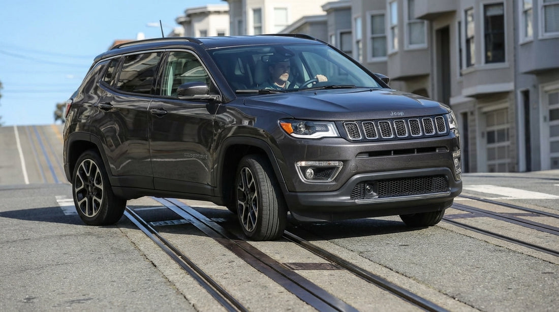 A car hire drives across the cable car tracks on a steep, sunny street in San Francisco