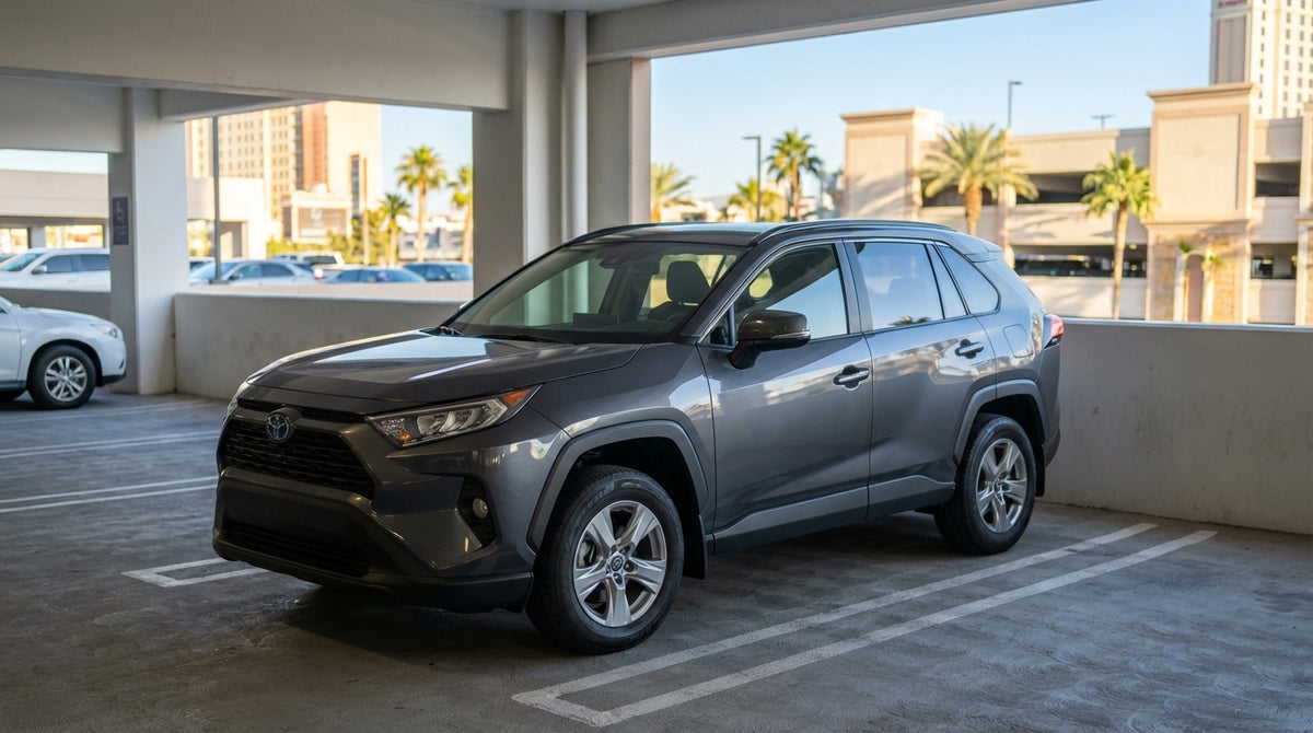 A car hire drives down the Las Vegas Strip at night toward the glowing, orb-shaped Sphere venue