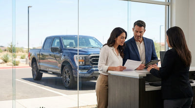 A modern car hire driving down a long, open highway through the scenic Texas hill country