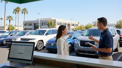 A man choosing a specific model from a line of diverse vehicles at a United Estates car hire agency