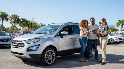 A white convertible car rental driving down a coastal highway lined with palm trees in sunny Florida