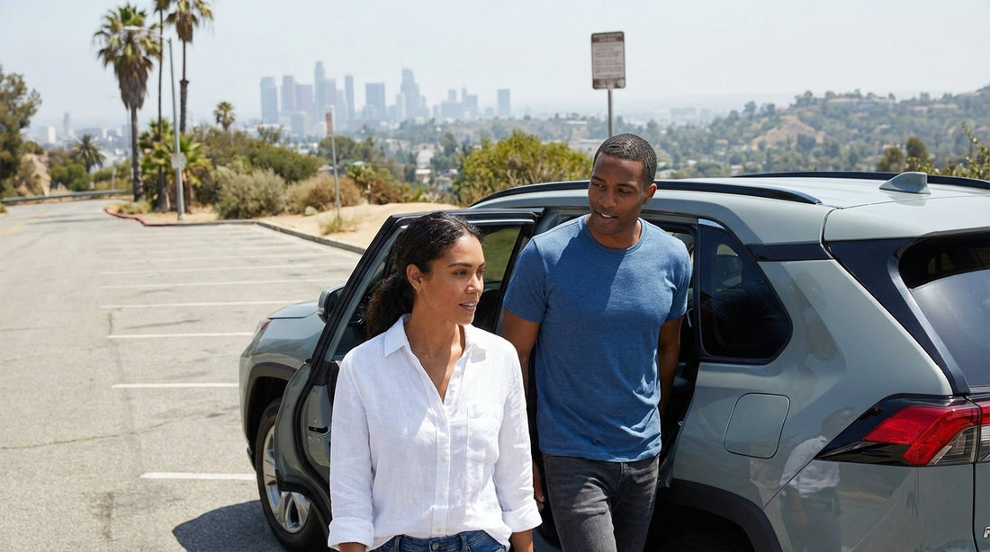 A car hire parked overlooking Griffith Observatory and the sprawling Los Angeles cityscape at sunset