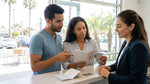 Person presenting a driving licence and passport at a California car hire counter