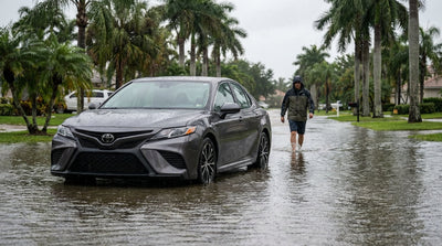 A car submerged in floodwater on a Florida street after a storm, a situation which may require an emergency car hire