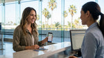A traveler completes paperwork at a car rental desk in the LAX airport terminal, Los Angeles