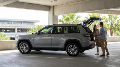 A row of vehicles available for car hire at an Orlando airport rental center on a sunny day
