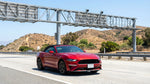 A car rental driving on a California highway under an electronic toll collection gantry