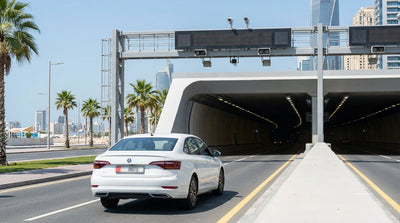 A car hire drives towards the entrance of the PortMiami Tunnel under a sunny blue sky