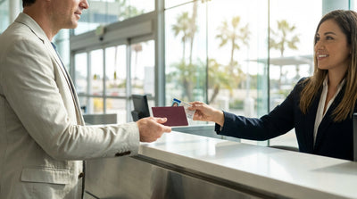 A red convertible car hire driving on a scenic coastal highway in California with ocean views