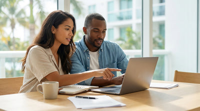 A red convertible car rental driving on a coastal road in Florida with palm trees and a bright blue sky