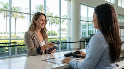 A convertible car rental driving on a sunny coastal highway with palm trees in Florida
